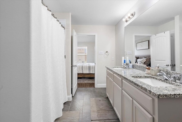 303 W Ohio Ave, Dallas, TX 75224 - full bath featuring a sink, ensuite bathroom, and double vanity