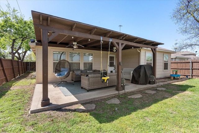 303 W Ohio Ave, Dallas, TX 75224 - rear view of property featuring a ceiling fan, a patio area, a fenced backyard, an outdoor hangout area, and a yard