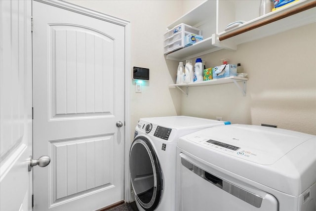 303 W Ohio Ave, Dallas, TX 75224 - clothes washing area featuring washer and dryer and laundry area