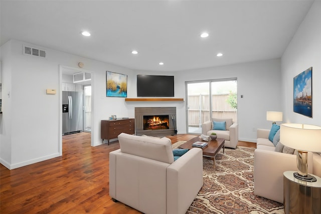 851 Dublin Dr Unit 3, Richardson, TX 75080 - living area with a lit fireplace, wood finished floors, recessed lighting, and baseboards