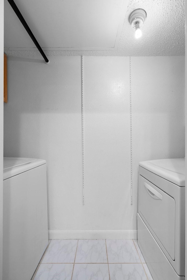 851 Dublin Dr Unit 3, Richardson, TX 75080 - laundry area with washing machine and clothes dryer and light marble finish flooring