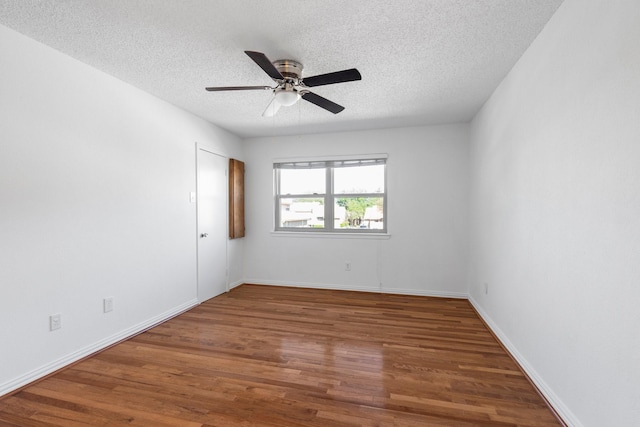 851 Dublin Dr Unit 3, Richardson, TX 75080 - empty room featuring a textured ceiling, wood finished floors, a ceiling fan, and baseboards