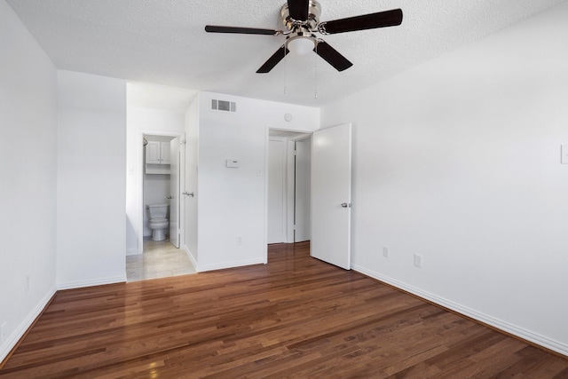 851 Dublin Dr Unit 3, Richardson, TX 75080 - unfurnished bedroom with wood finished floors, a textured ceiling, baseboards, ensuite bath, and a ceiling fan