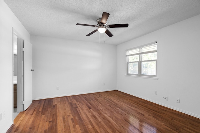 851 Dublin Dr Unit 3, Richardson, TX 75080 - spare room featuring wood finished floors, a ceiling fan, a textured ceiling, and baseboards