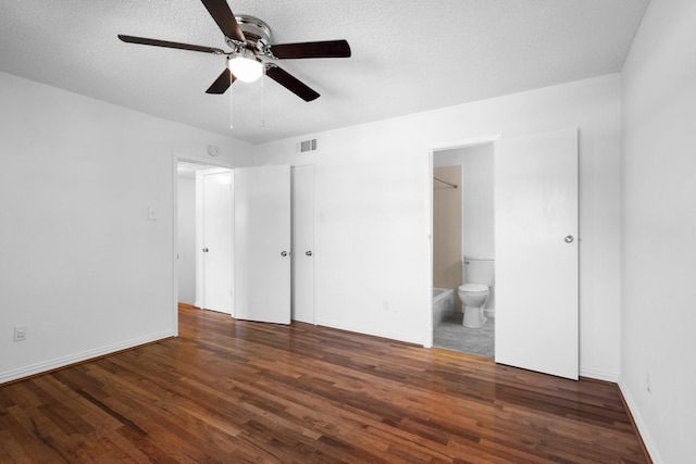 851 Dublin Dr Unit 3, Richardson, TX 75080 - unfurnished bedroom featuring wood finished floors, ensuite bathroom, a textured ceiling, and baseboards