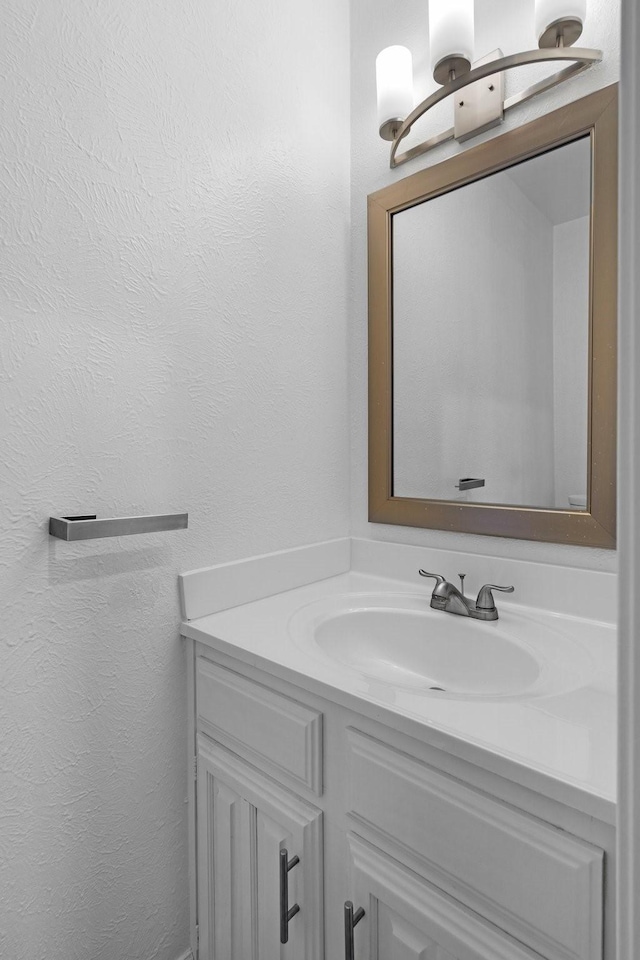 851 Dublin Dr Unit 3, Richardson, TX 75080 - bathroom featuring a textured wall and vanity