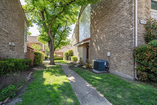 851 Dublin Dr Unit 3, Richardson, TX 75080 - view of green lawn with central AC