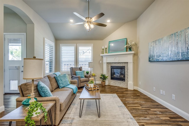 8205 San Bernard Trl, Mckinney, TX 75071 - living room featuring a wealth of natural light, a tiled fireplace, dark wood-style flooring, and a ceiling fan