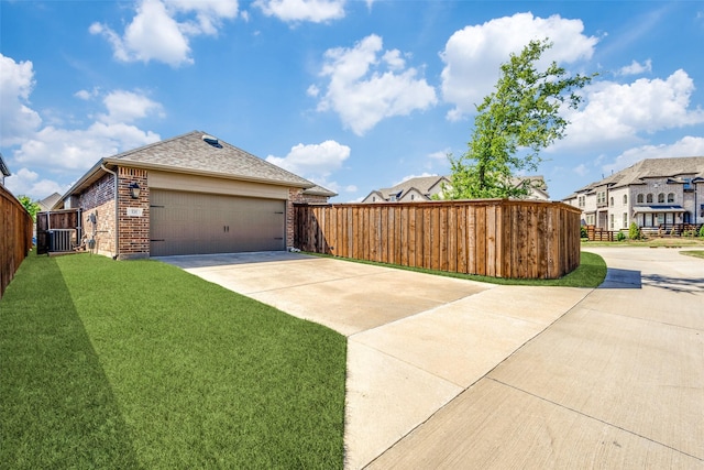 8205 San Bernard Trl, Mckinney, TX 75071 - view of home's exterior with central air condition unit, driveway, brick siding, a yard, and fence