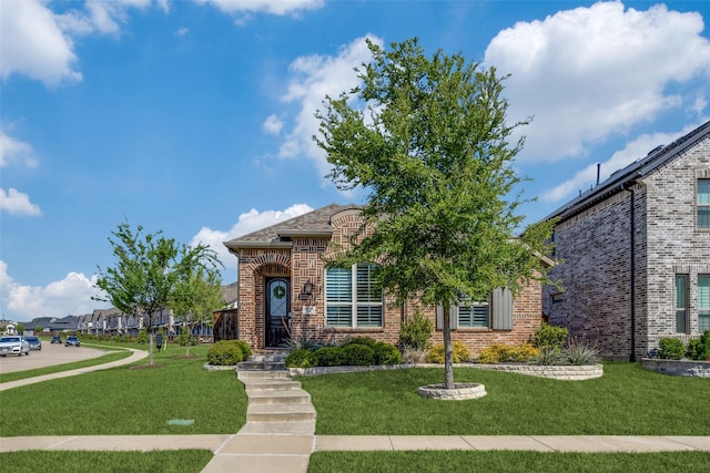 8205 San Bernard Trl, Mckinney, TX 75071 - french provincial home featuring a front yard and brick siding