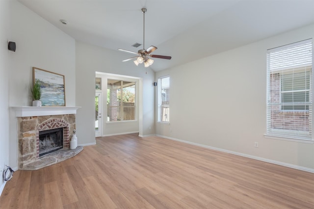 5208 Birchwood Dr, Mckinney, TX 75071 - unfurnished living room featuring light wood-style floors, baseboards, and a stone fireplace