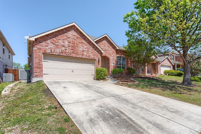 5208 Birchwood Dr, Mckinney, TX 75071 - view of front facade with a front lawn, brick siding, an attached garage, driveway, and central AC unit