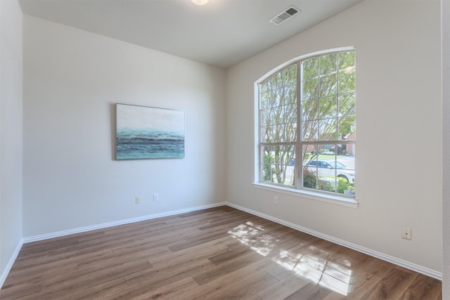 5208 Birchwood Dr, Mckinney, TX 75071 - empty room featuring wood finished floors, baseboards, and a wealth of natural light