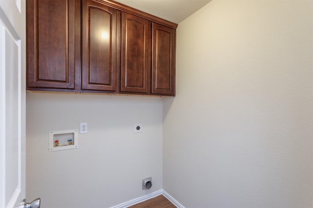 5208 Birchwood Dr, Mckinney, TX 75071 - washroom with hookup for an electric dryer, baseboards, washer hookup, cabinet space, and wood finished floors