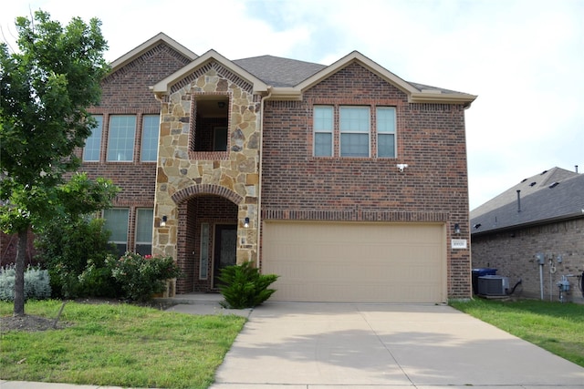 view of front of property with driveway, a garage, brick siding, and stone siding