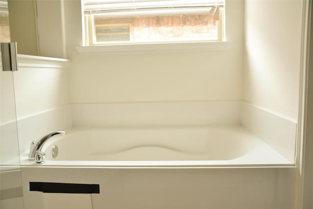 bathroom featuring a garden tub