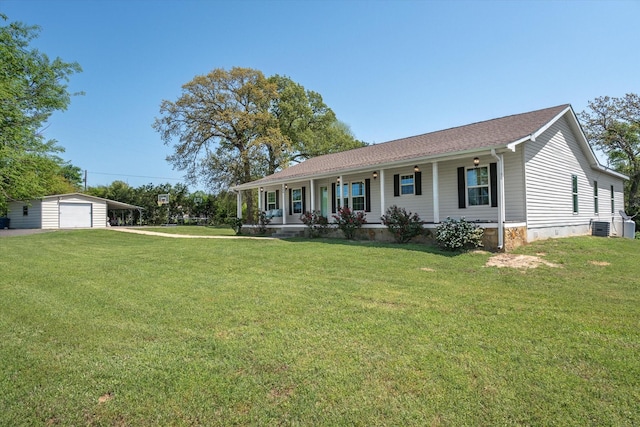 ranch-style house featuring a porch, a garage, cooling unit, an outdoor structure, and a front lawn