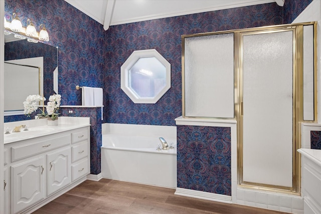 bathroom featuring wallpapered walls, wood finished floors, a shower stall, a bath, and vanity