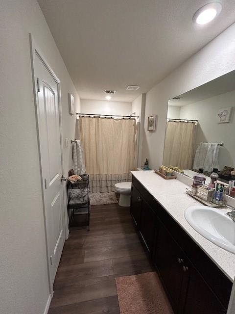 345 Wishbone Ln, Fort Worth, TX 76052 - full bath with vanity, visible vents, toilet, and wood finished floors