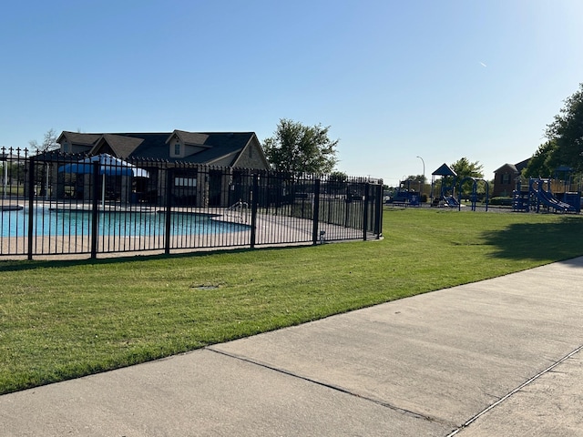 345 Wishbone Ln, Fort Worth, TX 76052 - pool featuring a lawn, fence, and playground community