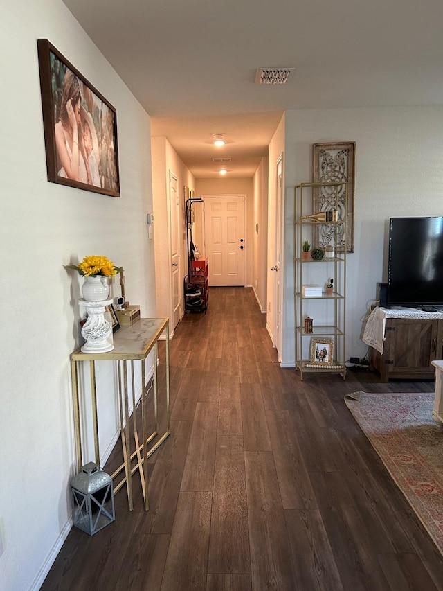 345 Wishbone Ln, Fort Worth, TX 76052 - hallway with baseboards, dark wood-style floors, and visible vents