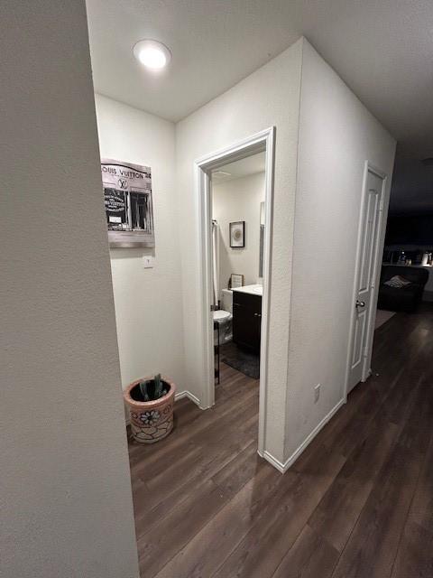 345 Wishbone Ln, Fort Worth, TX 76052 - hallway with dark wood-type flooring and baseboards