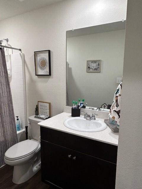 345 Wishbone Ln, Fort Worth, TX 76052 - full bathroom with toilet, wood finished floors, vanity, and shower / bath combination with curtain