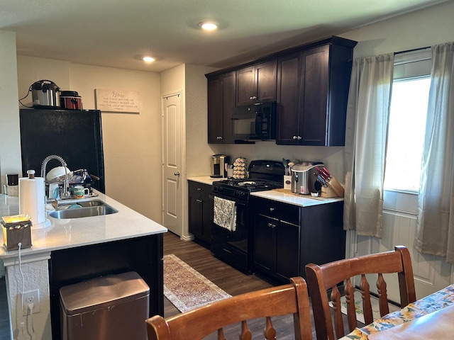 345 Wishbone Ln, Fort Worth, TX 76052 - kitchen with a sink, dark wood finished floors, black appliances, and a healthy amount of sunlight