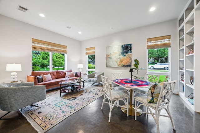6604 Northridge Dr, Dallas, TX 75214 - living room featuring healthy amount of natural light, recessed lighting, and finished concrete floors