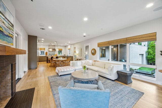 6604 Northridge Dr, Dallas, TX 75214 - living area featuring a fireplace, light wood finished floors, and recessed lighting
