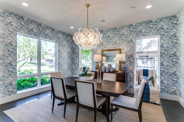 bar featuring a notable chandelier, a healthy amount of sunlight, a sink, and wine cooler