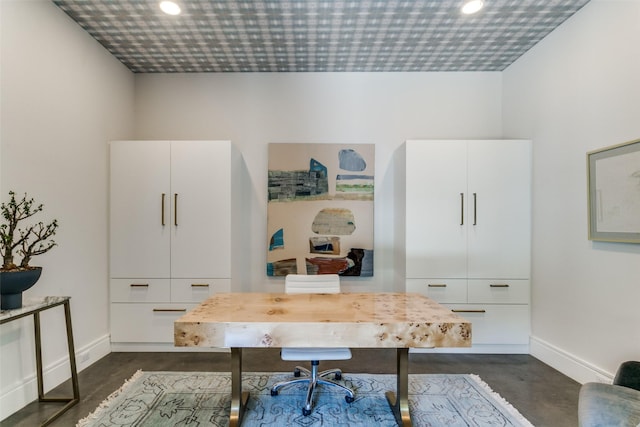 office featuring baseboards, recessed lighting, and finished concrete floors