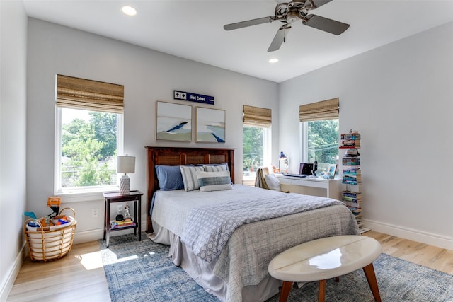 bedroom with baseboards, recessed lighting, ceiling fan, and wood finished floors