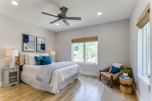 bedroom with recessed lighting, baseboards, and light wood finished floors