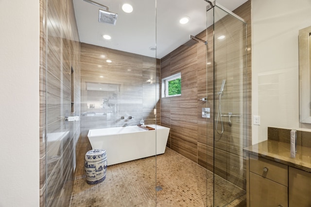 6604 Northridge Dr, Dallas, TX 75214 - full bath featuring a shower stall, a freestanding bath, and tile walls
