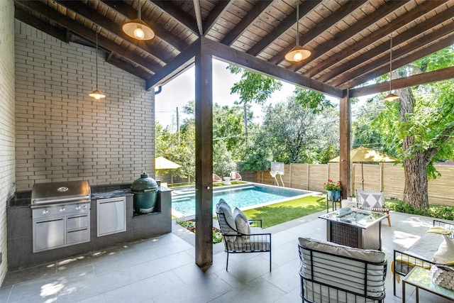 view of patio / terrace with area for grilling, a fenced in pool, and a fenced backyard