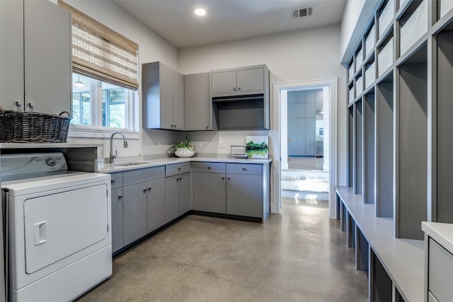 6604 Northridge Dr, Dallas, TX 75214 - washroom with washer / dryer, cabinet space, and recessed lighting