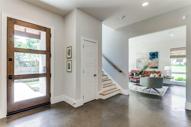 sitting room with visible vents, finished concrete flooring, baseboards, recessed lighting, and a chandelier
