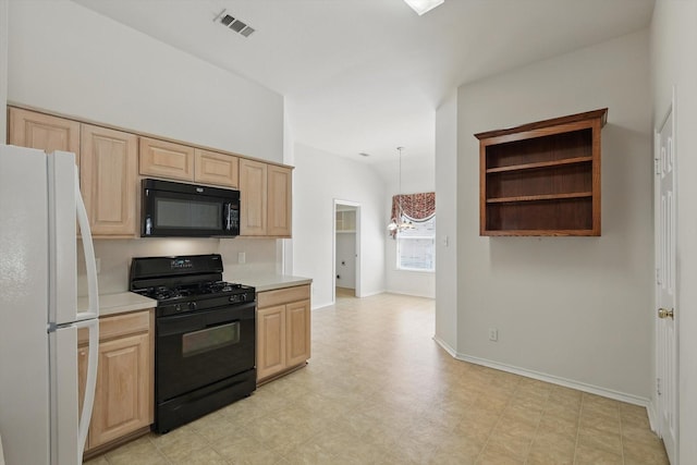 kitchen with black appliances, light brown cabinetry, light countertops, light floors, and baseboards