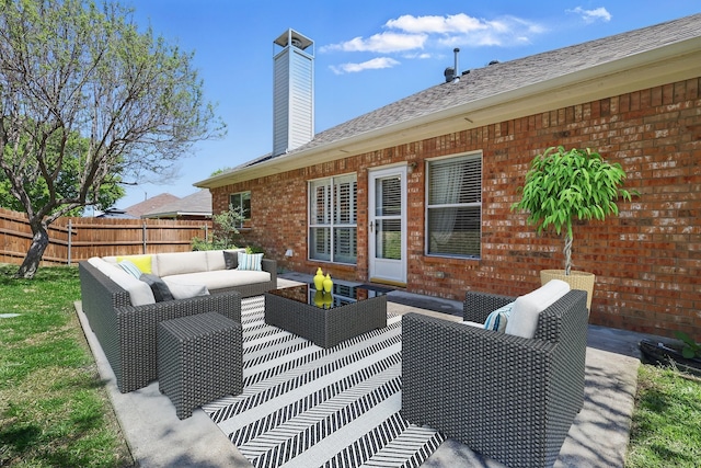 view of patio / terrace featuring an outdoor hangout area and fence
