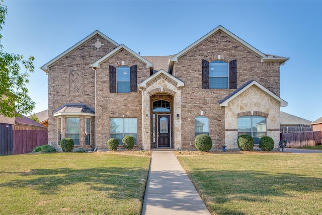 1348 Meadowview Dr, Kennedale, TX 76060 - view of front of home with fence, brick siding, a garage, a front yard, and driveway