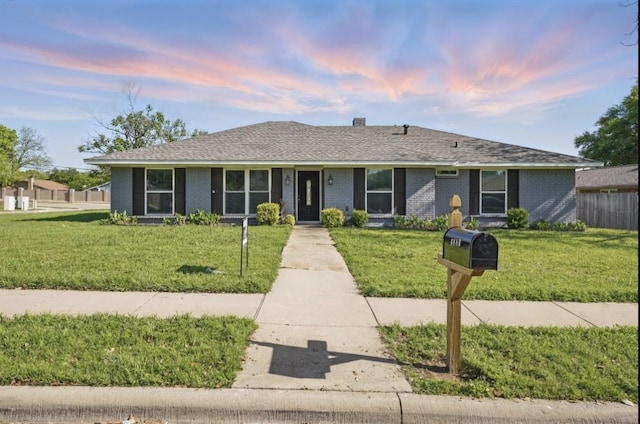 3321 Lynbrook Dr, Plano, TX 75075 - ranch-style house featuring a shingled roof, brick siding, and a lawn