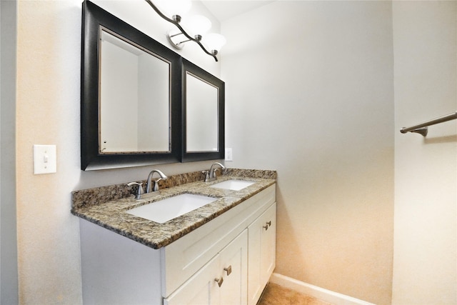 3321 Lynbrook Dr, Plano, TX 75075 - bathroom with a sink, baseboards, and double vanity