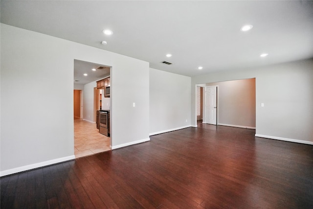 3321 Lynbrook Dr, Plano, TX 75075 - unfurnished room with hardwood / wood-style floors, baseboards, visible vents, and recessed lighting