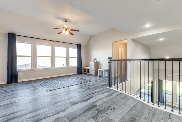 8321 Burnley, The Colony, TX 75056 - spare room featuring wood finished floors, a ceiling fan, lofted ceiling, baseboards, and recessed lighting