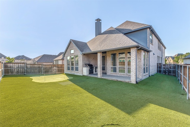 8321 Burnley, The Colony, TX 75056 - back of property featuring brick siding, a chimney, a patio area, and a shingled roof