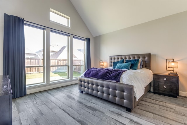 8321 Burnley, The Colony, TX 75056 - bedroom featuring light wood-style flooring and high vaulted ceiling