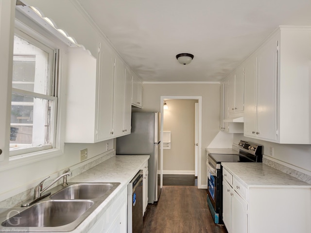 kitchen with stainless steel appliances, a wealth of natural light, white cabinetry, and a sink