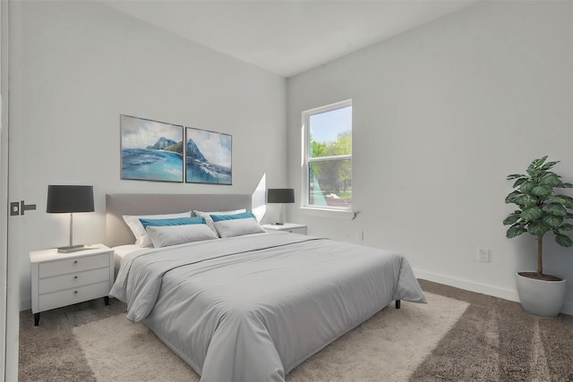 bedroom featuring baseboards and carpet floors