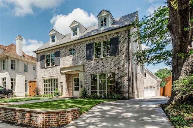 colonial home with brick siding and fence